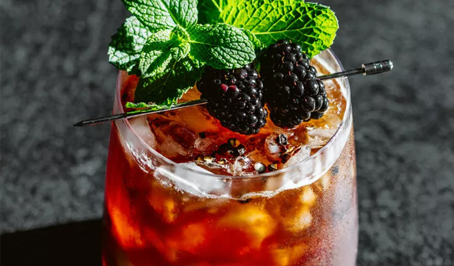 cocktail with rasberries on ice
