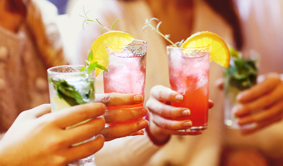 four people toasting no alcohol drinks