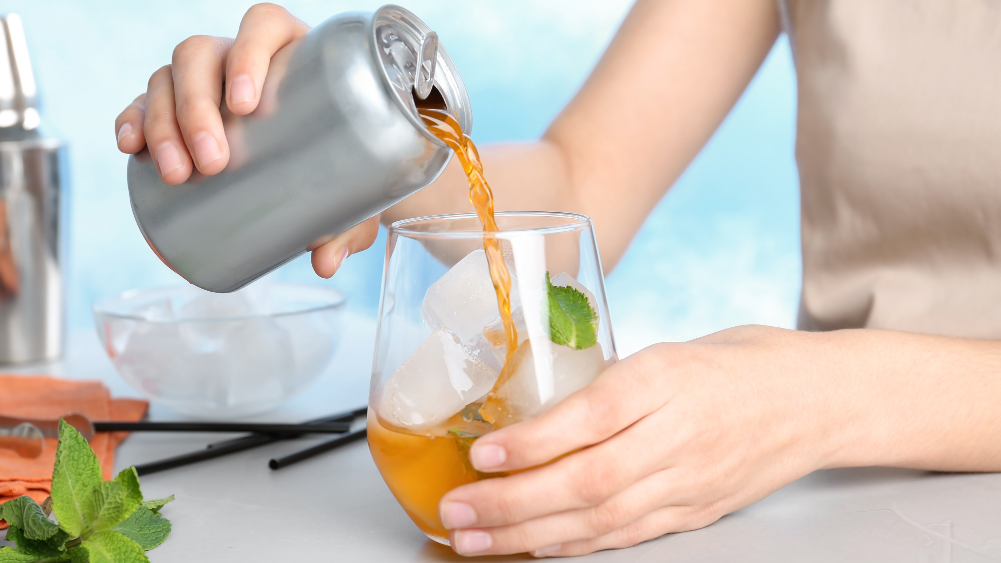 woman pouring cbd infused drink